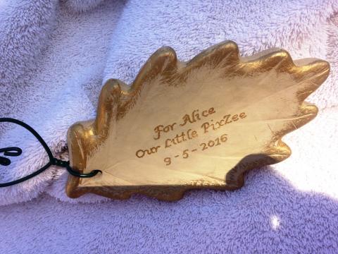 engraved leaf-shaped tree tag