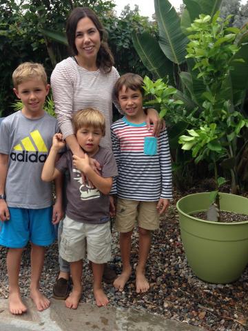 Mom and three boys with patio lemon tree